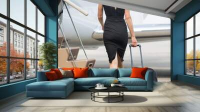 Rich Woman With Luggage Walking Towards Private Jet Wall mural