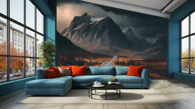 A road in the mountains with a cloudy sky Wall mural