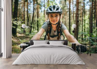 Mountain biking in the forest girl biker Wall mural