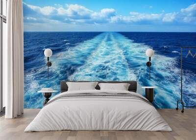 Waves, foam and wake caused by cruise ship in the sea. Atlantic ocean with blue water on a sunny day. Wall mural