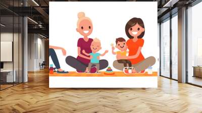 Group of mothers with babies. Club of young mothers. Mommies are sitting with children Wall mural