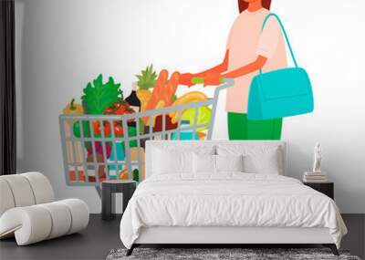 Woman with a grocery cart in the supermarket. Buying food. Customer at a retail grocery store Wall mural