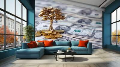 Conceptual image of a golden coin tree growing from a stack of dollar bills representing investment growth. Wall mural