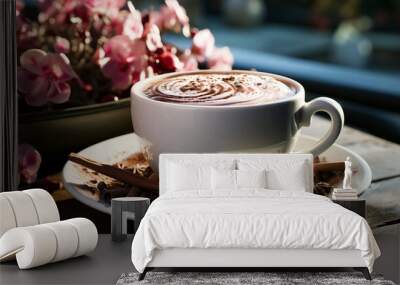 Delicious hot chocolate with appetizing whipped milk foam and cinnamon in a mug. Wall mural