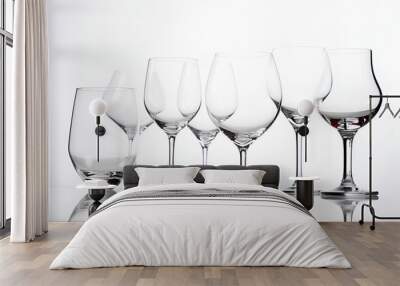 Empty transparent wine glasses on a table on light background. AI generated Wall mural