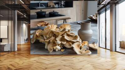 Wild mushrooms spread out on a table in modern kitchen. Wall mural