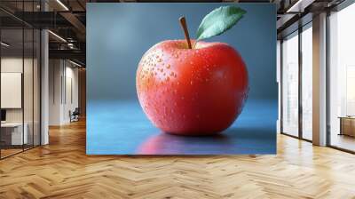 A red apple with a green leaf on top Wall mural