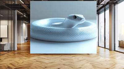 A white snake is curled up in a circle on a white surface Wall mural