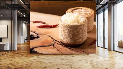 Asian Thai food Glutinous or sticky rice in bamboo wicker on wooden background with copy space Wall mural