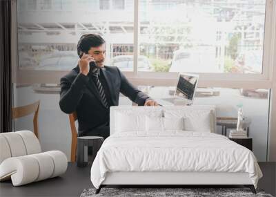 business caucasian man sitting in working in co working space Wall mural