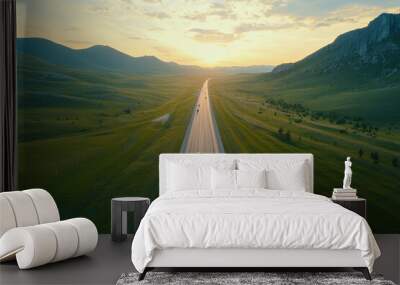 Aerial view of highway road cars driving mountains at sunset Wall mural