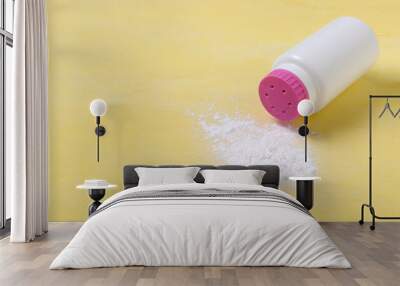 Closeup of baby powder on the yellow background.White bottle with pink cap of baby powder Wall mural