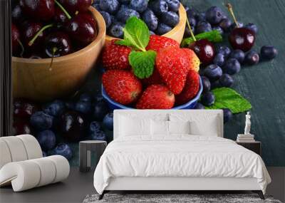 Fresh fruits berries, strawberry, cherries, blueberry on wooden background. Wall mural