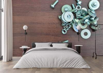 Metal screw and nut on wooden background Wall mural