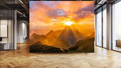 Sunset on the mountain with clouds and sky colors. Wall mural