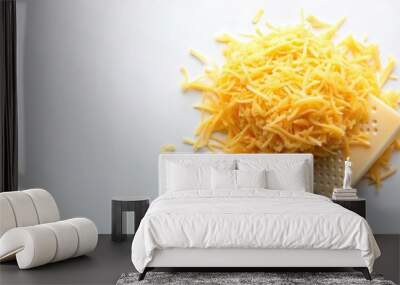 Top view of grated cheddar cheese with a white background, grated, cheddar cheese, top view, food, dairy, ingredient Wall mural