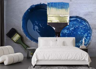 Blue paint brush and can on wood floor. Top view Wall mural