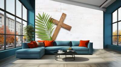 Cross and palm on wooden white background easter sign symbol concept Wall mural