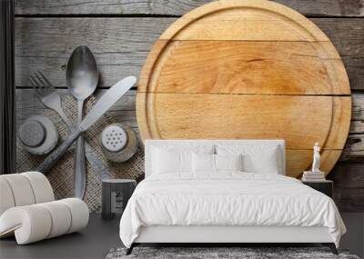 Cutlery and vintage empty cutting board food background concept Wall mural