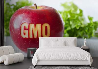 GMO text on red apple, concept of genetically modified foods Wall mural