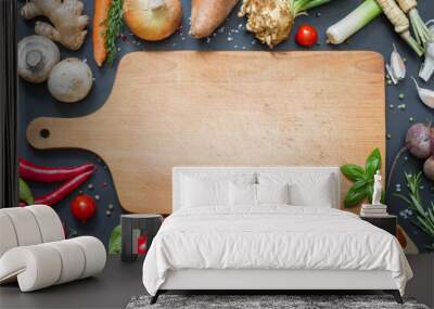 Spice herbs and vegetables frame food background and empty cutting board
 Wall mural