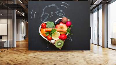 Time alarm on diet and healthy lifestyle concept with fruits and vegetables and  clock on blackboard Wall mural