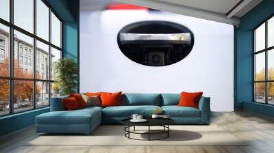 Rear view camera. Luxury back car rear view camera for parking assistance. Concept of safety car driving while parking process. Assist device equipment in modern electric cars. Wall mural