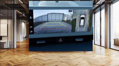 Surround view monitor. Front camera of circular 360 degrees view system. 360 terrain system in a modern car. Dashboard display screen with multimedia and 360 camera view in a new luxury vehicle Wall mural