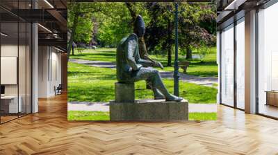 statue of a person in the park Wall mural