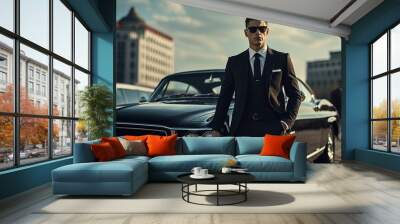 A stylish man posing next to a luxury car Wall mural