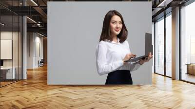 Business woman working online on a laptop Wall mural