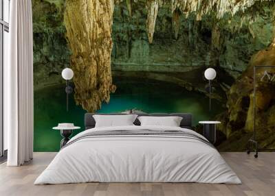 Man enjoying the view of Suytun Cenote from the top Yucatan Mexico North America Wall mural