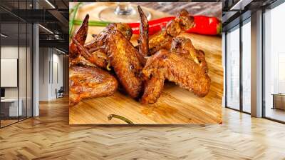 Composition with smoked chicken wings on the table Wall mural