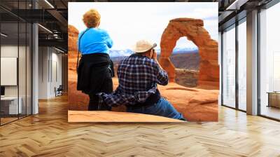 Seniors couple enjoying the beauty of Delicate Arch, Utah, Wall mural