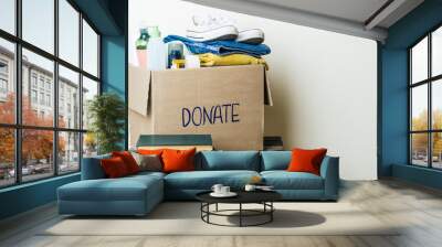 CLOTHES DONATION AND FOOD DONATION CONCEPT. Donation box with clothes and hygiene products. Copy space Wall mural