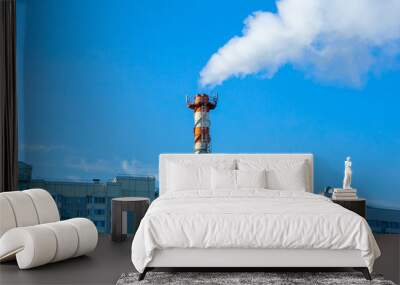 Smoke pollution. Smoke pipes against the blue sky Wall mural