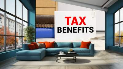 a card with text tax benefits on the table Wall mural