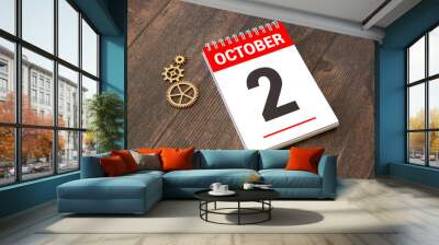 October 2 on a wooden calendar on a table or shelf. Wall mural