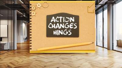 text Action Changes Things on black card Wall mural