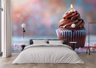 Chocolate birthday cupcake  burning candle and blurred background, space for text Wall mural