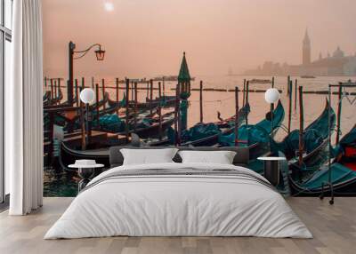 gondolas moored by saint mark square with san giorgio di maggiore church on background Wall mural