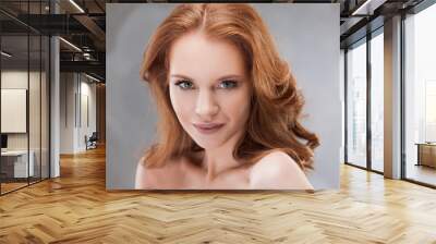 Portrait of young beautiful red-haired woman Caucasian type Wall mural