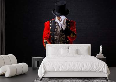 Showman. Young male entertainer, presenter or actor on stage. The guy in the red camisole and the cylinder. Wall mural