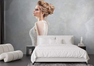 Wedding style. Beautiful young bride with luxury wedding hairstyle Wall mural