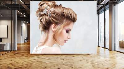 Wedding style. Beautiful young bride with luxury wedding hairstyle Wall mural