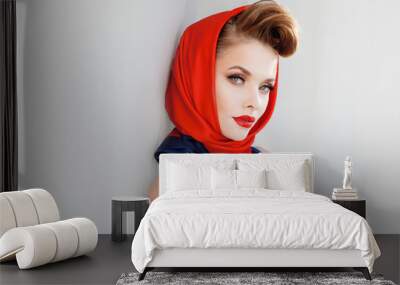 young beautiful woman with red lipstick and a headscarf. Wall mural