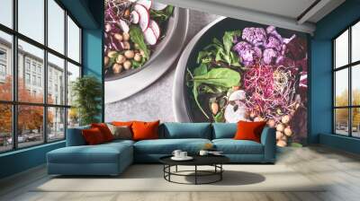 Healthy green dinner or lunch setting. Flat-lay of vegan superbowls or Buddha bowls with , vegetables, fresh salad, chick beas, purple broccoli. Healthy green dinner or lunch  Wall mural