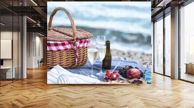 Summer beach  romantic picnic at sunset. Seaside light evening picnic  with fresh fruit and tray of tasty appetizers,  glasses with sparkling wine Wall mural