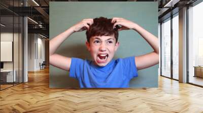  boy scratch his head isolated on blue Wall mural