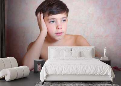 handsome preteen boy with hand in bandage Wall mural